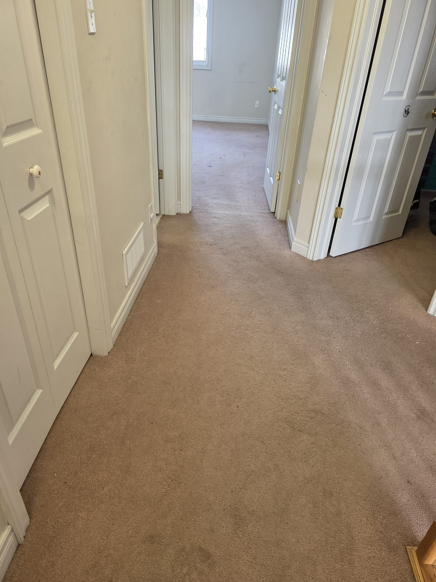 Original concrete subfloor exposed before vinyl plank flooring installation.