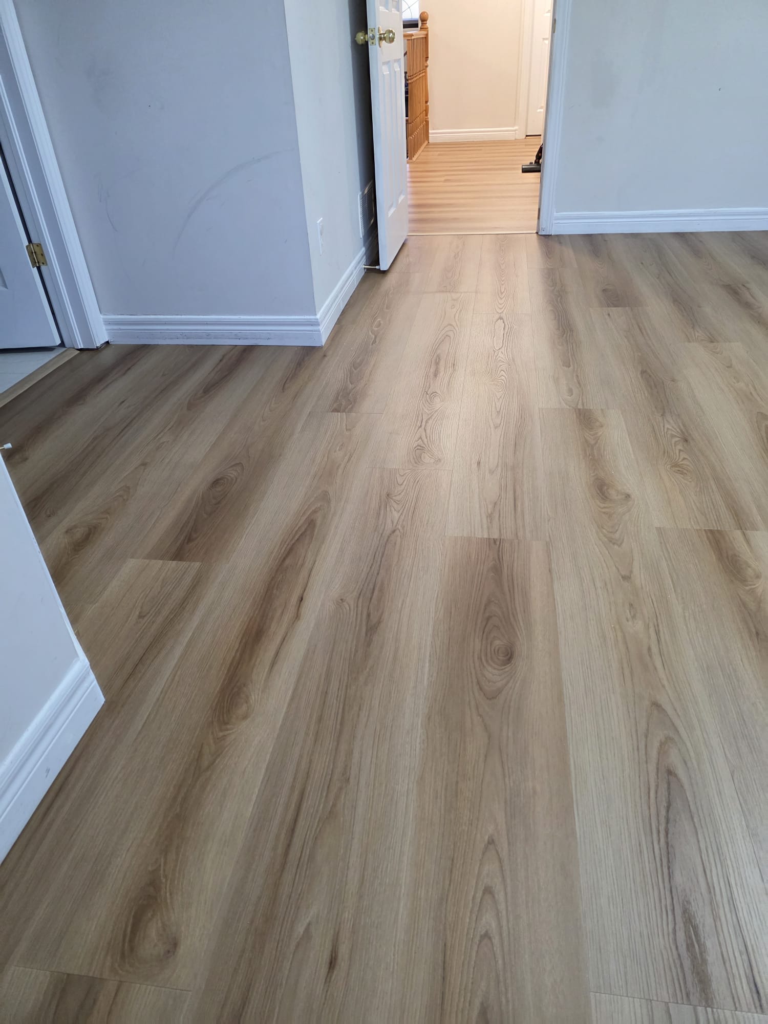 Transformed living space with high-quality, finished vinyl planks.