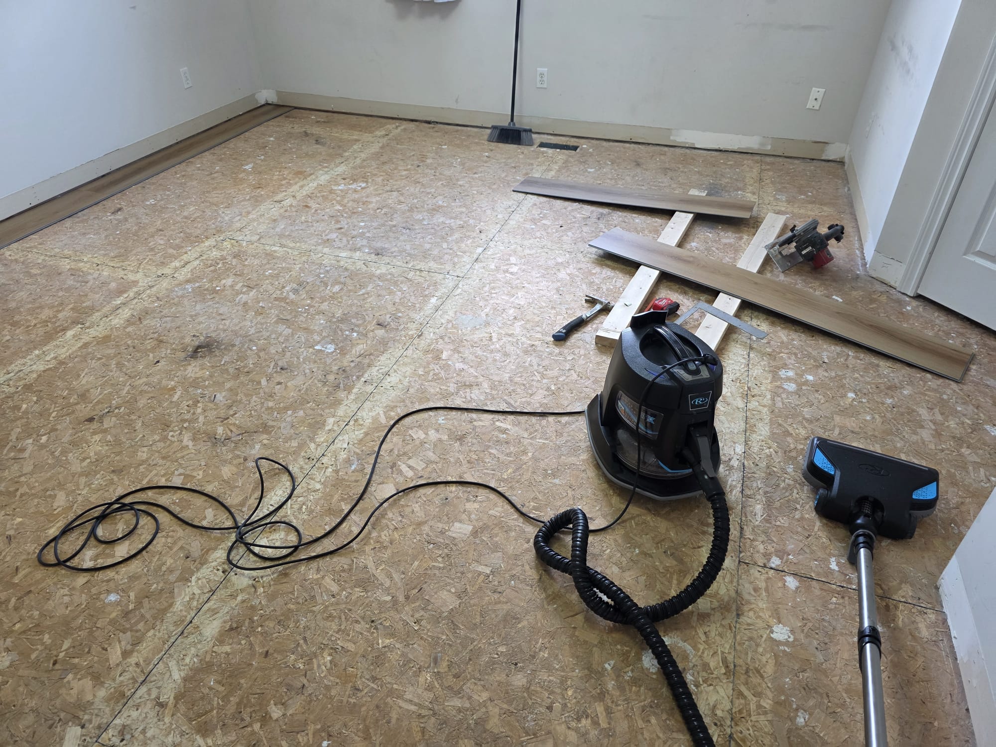 Subfloor preparation and layout planning for seamless vinyl flooring.